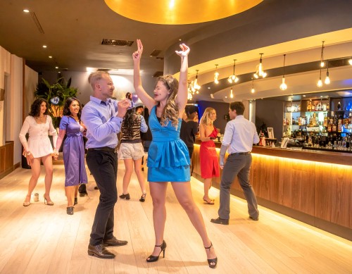 Firefly please show the inside of a cosmopolitan club in nz showing people dancing and the ba 681076